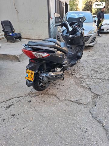 מודעת רכב סאן יאנג ג'וי-מקס 300 XI