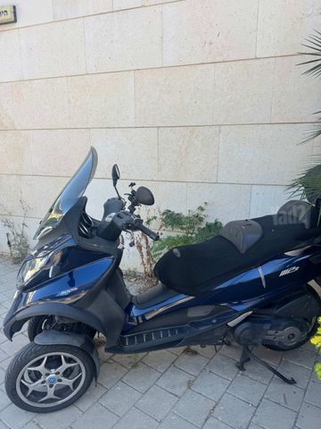 מודעת רכב פיאג'ו MP3 500